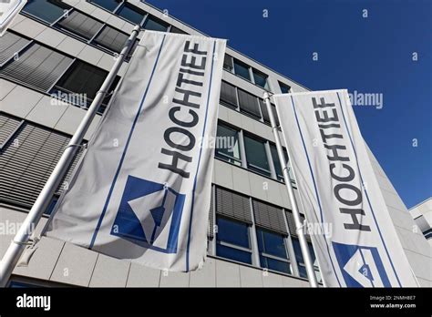 Hochtief AG, flags with logo at company headquarters, construction ...