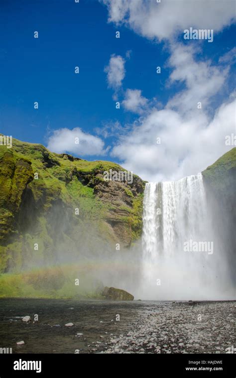 skogafoss waterfall with rainbow in iceland Stock Photo - Alamy