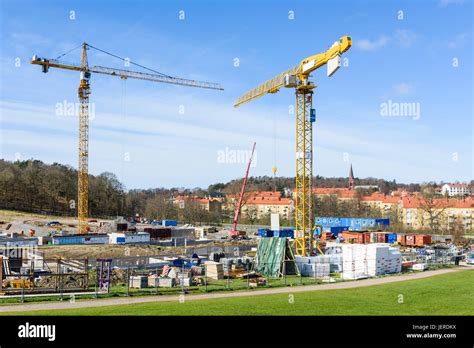 Building cranes on construction site Stock Photo - Alamy