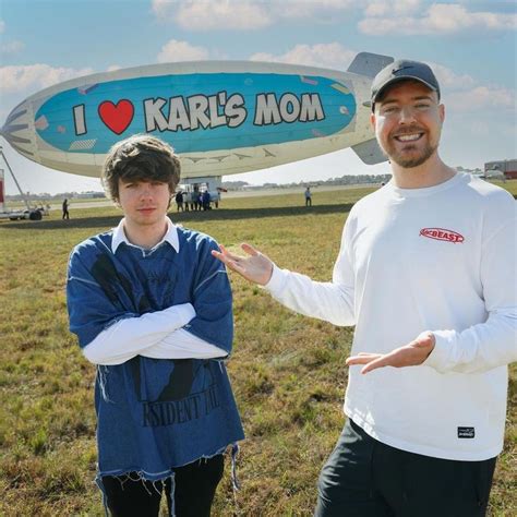 two men standing in front of a large balloon with the words i love karl ...