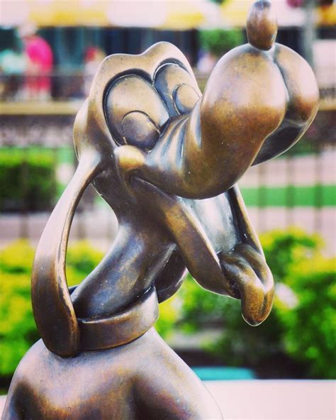 Pluto bronze statue at Magic Kingdom, Walt Disney World | Disney ...