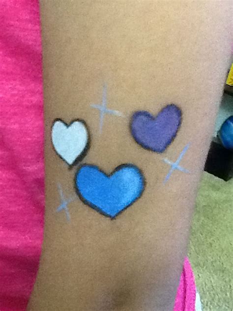 My frozen hearts | Face painting, Paw print tattoo, Print tattoos