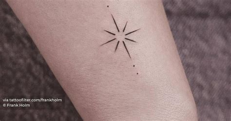 Minimalist North Star tattoo on the wrist.