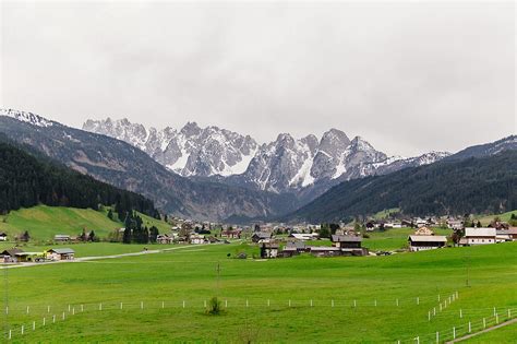 "Austrian Village Against Of Rocky Mountains In Snow" by Stocksy ...