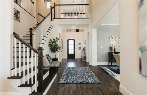 Two-story foyer white foyer with hardwood floors; The Sorenna floor ...