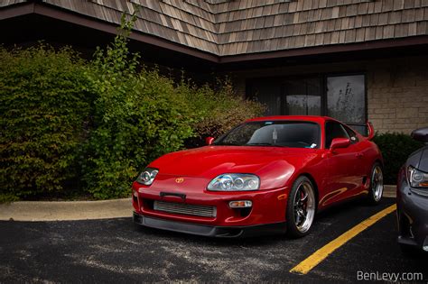 Red Mk4 Toyota Supra outside of Executive Motor Carz - BenLevy.com