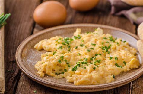 Scrambled eggs with herbs stock image. Image of food - 102884131