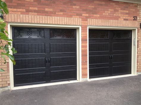 8x7 Clopay steel insulated long panel Carriage Doors in Black with ...