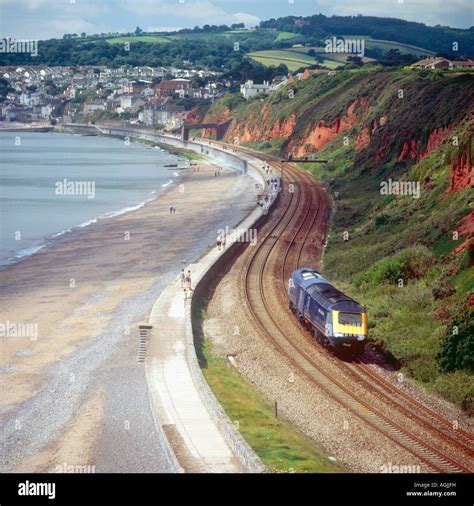 The railway along the sea wall at Dawlish near Langstone Rock with a ...