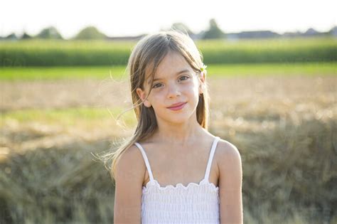 Portrait of smiling little girl in nature stock photo