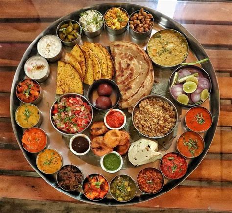 This enormous thali includes more than 25 dishes apart from the two ...