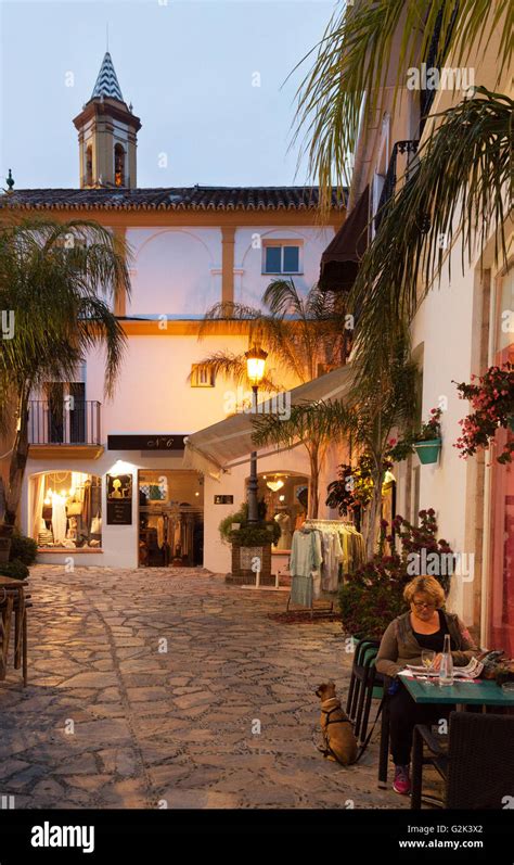 People eating at an outdoor restaurant at dusk, Estepona old town ...