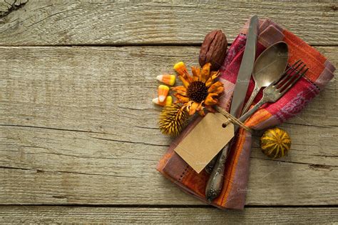 Thanksgiving table setting on rustic wood background containing ...