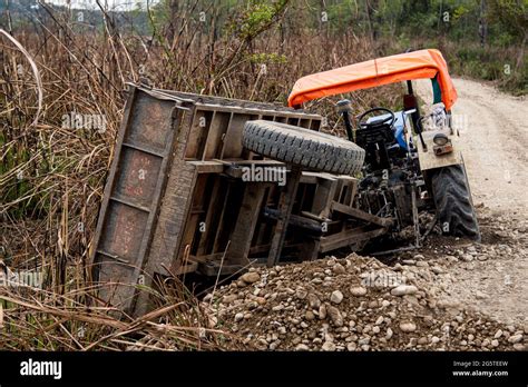 Trolley of agriculture tractor accident on the side of a rural road ...