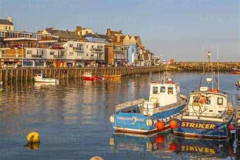 View of harbour boats and harbourside shops in Bridlington Harbour at ...