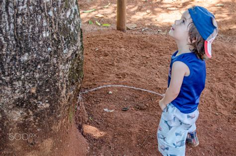 Child peeing by Haendel Sindra / 500px