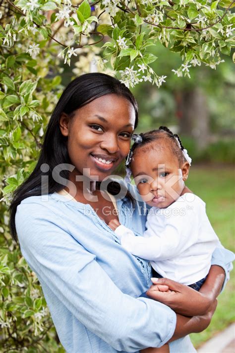 African American Mother Holding Baby Girl Stock Photo | Royalty-Free ...