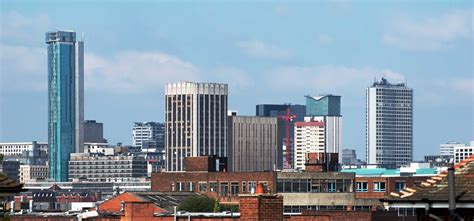 a city skyline with tall buildings in the background