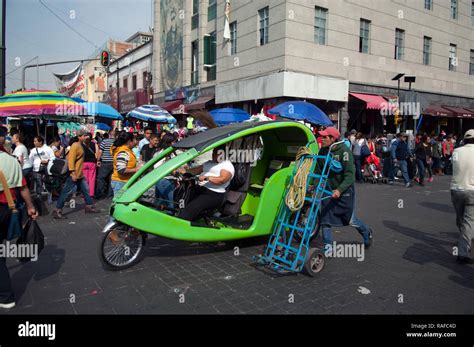 A moto taxi driving through a Mexico City Market Stock Photo - Alamy