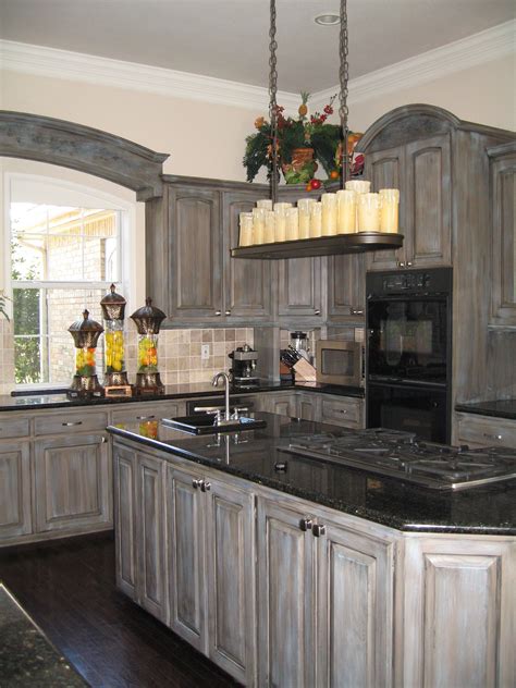 Glaze added a touch of blue to these gray stained cabinets for a fresh ...