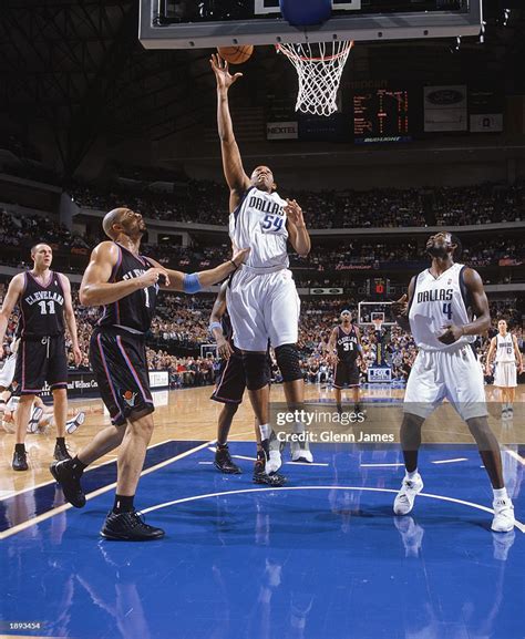 Popeye Jones of the Dallas Mavericks takes the shot against Carlos ...