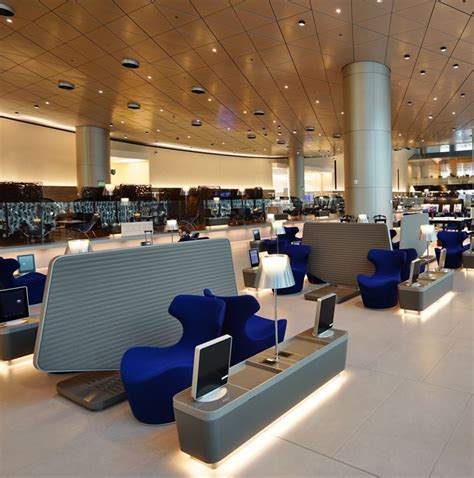 Doha Qatar business class airport lounge with luxruious blue recliners ...