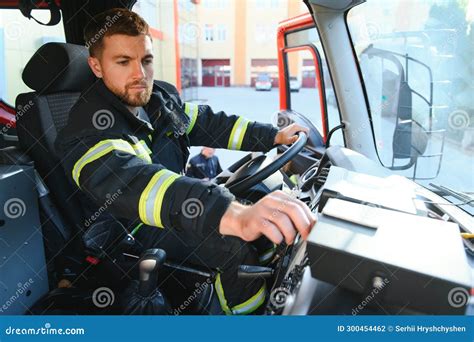 Firefighter Using Radio Set while Driving Fire Truck Stock Photo ...