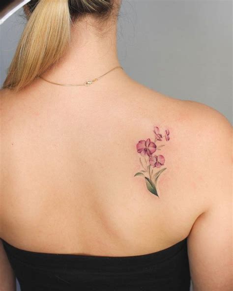 Orchids tattoo on the right shoulder blade | Shoulder blade tattoo ...