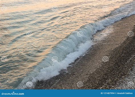 Wave Breaker on the Beach at Sunset. Stock Photo - Image of breakers ...