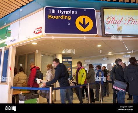 Passengers stand in a queue in the boarding area inside the Kiruna ...