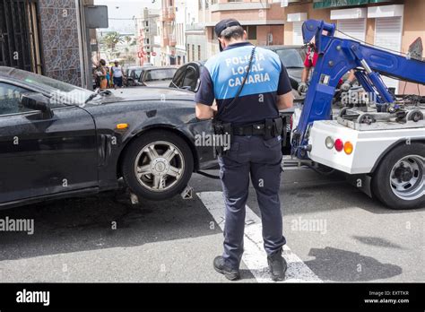 illegally parked car being towed away by Police in Canary Islands Stock ...