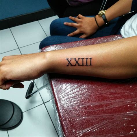 Roman Numerals With Name Tattoo