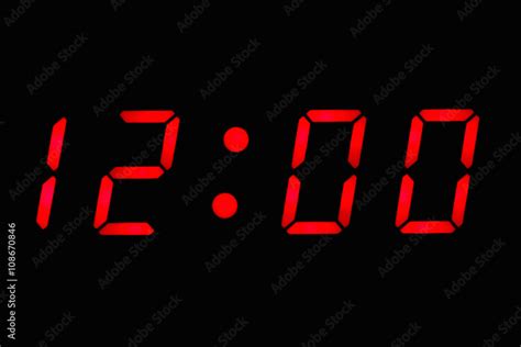 Digital clock displaying 12:00 o'clock Stock Photo | Adobe Stock