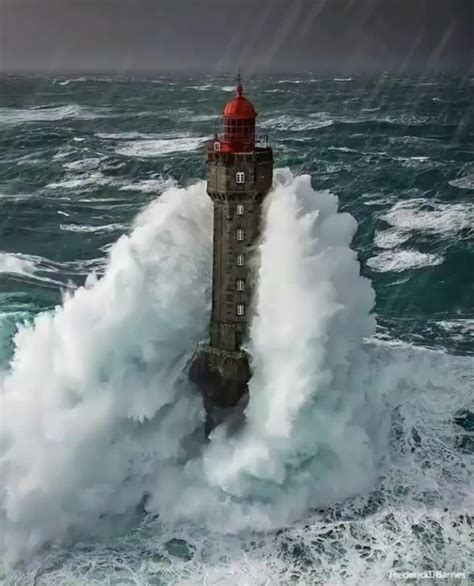 This lighthouse in a storm (France, Brittany) : Damnthatsinteresting