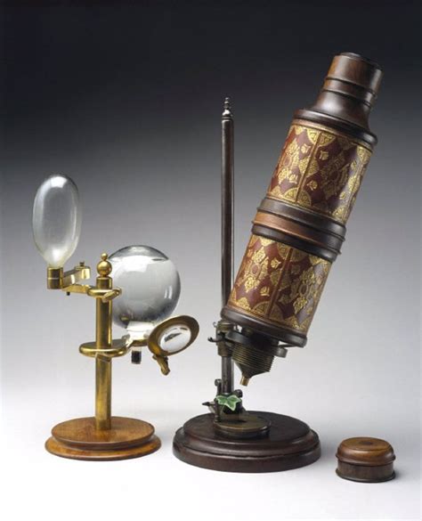 Microscope associated with Robert Hooke (1635-1703), shown with a copy ...