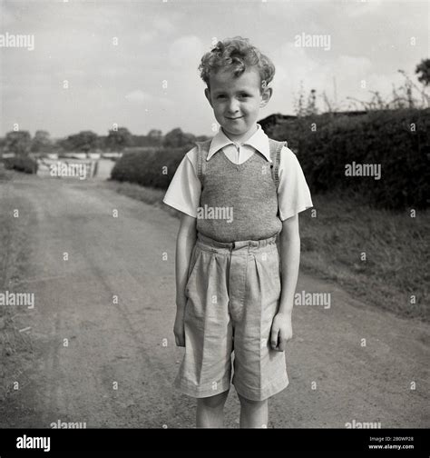 1950s, historical, young boy standing on a countyr path, England, UK ...