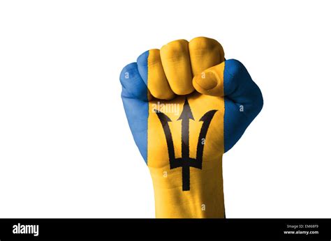 Low key picture of a fist painted in colors of barbados flag Stock ...