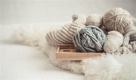 Free Photo | Cozy background Wallpaper with the yarn for knitting.