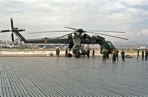 A 1st Air Cavalry Sikorsky CH-54 Tarhe being loaded with a BLU-82 ...