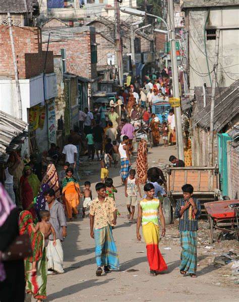 The hustle-bustle of a typical street in the slums, Dhaka, Bangladesh ...