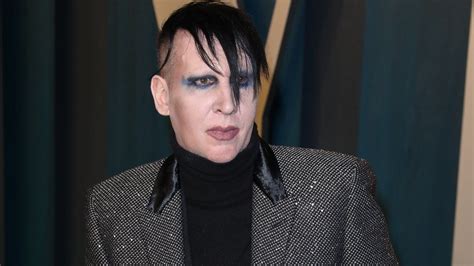 Marilyn Manson fined for blowing nose on concert camerawoman - BBC News