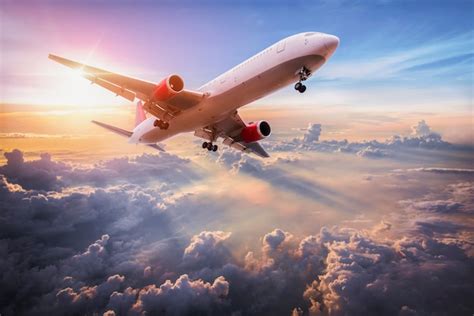 Premium Photo | Landscape with aircraft is flying above clouds in the ...