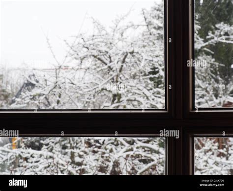 A beautiful view of look through window with snow outside in winter ...