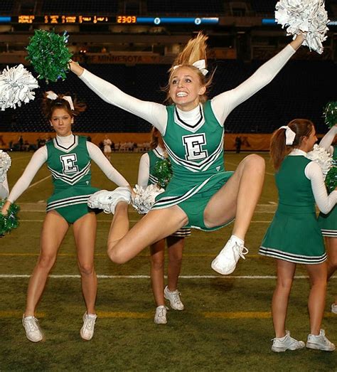 Cheerleaders Perform at Football Game