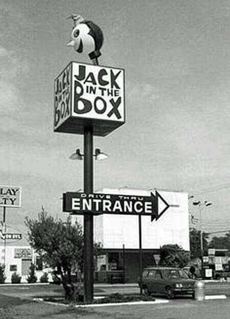 black and white photograph of jack in the box sign