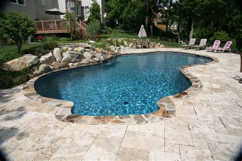 Free form in ground concrete/plaster/gunite pool. Stone coping. Natural ...