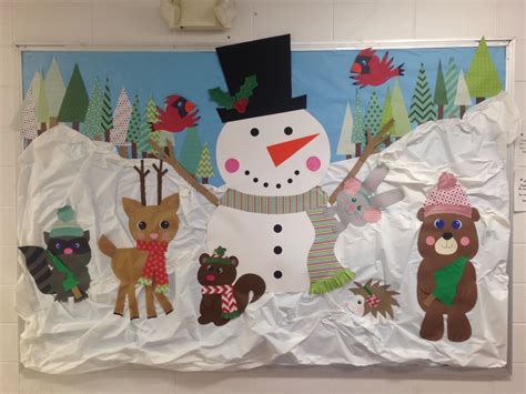 a bulletin board with an image of a snowman, deer, and bear on it