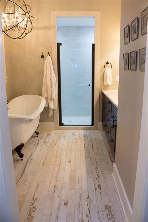 Rustic bathroom in a new home. whitewashed flooring with a rustic ...