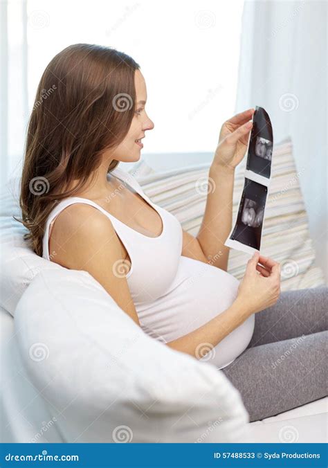 Happy Pregnant Woman with Ultrasound Image at Home Stock Image - Image ...