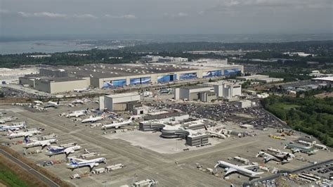 5K stock footage aerial video of Boeing Everett Factory and rows of ...